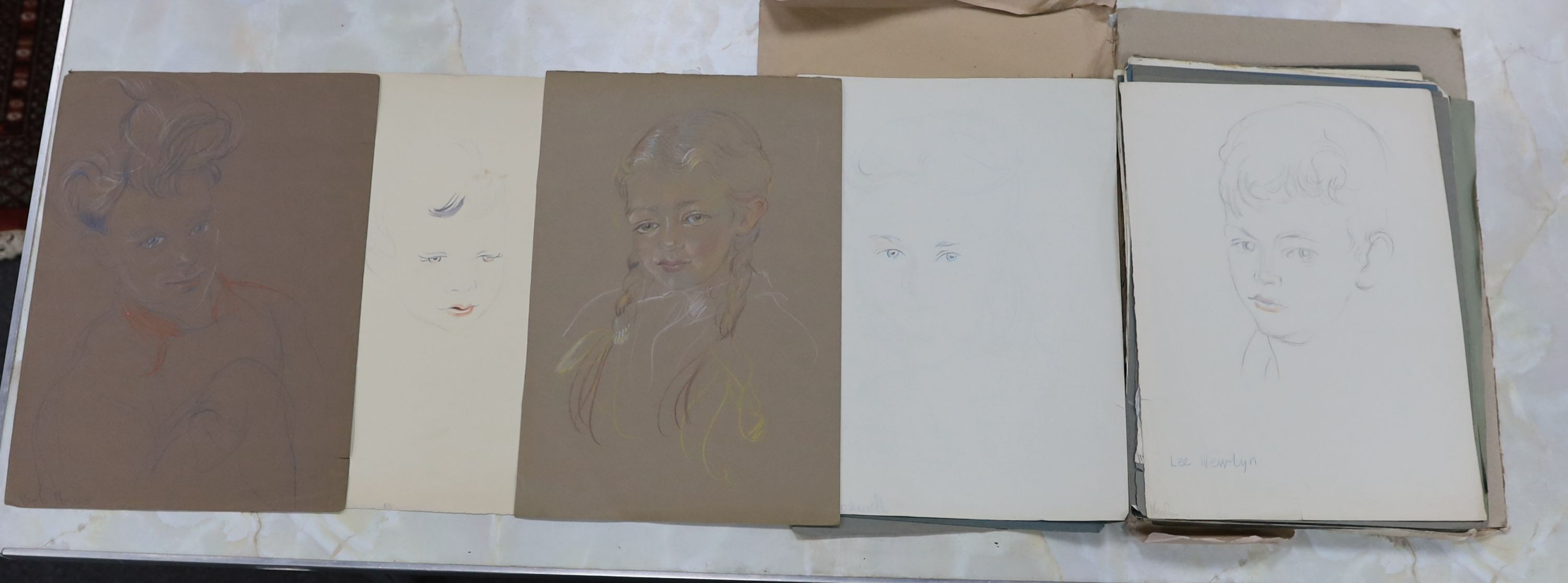 Athene Andrade (1908-1975), a folio of assorted watercolour and coloured pencil portrait sketches, approximately 39 x 28cm